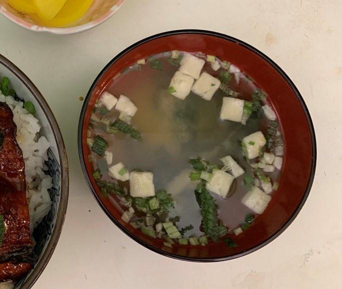 Make miso soup: Add dry and miso paste packets in a bowl of 1 cup hot water.